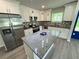 Kitchen with granite island, stainless appliances, custom backsplash, and pendant lighting at 1351 E Atlanta E Rd, Stockbridge, GA 30281