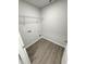 Functional laundry area with gray wood-look floors and convenient hookups at 1351 E Atlanta E Rd, Stockbridge, GA 30281