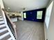 Bright and airy living room features light wood floors, a ceiling fan, and views into the adjacent kitchen at 1351 E Atlanta E Rd, Stockbridge, GA 30281