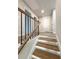 Stairway features wood steps and black metal balusters at 1351 E Atlanta E Rd, Stockbridge, GA 30281