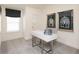 Comfortable home office space featuring a modern desk, chair, ample lighting, and stylish decor at 2680 Ne Almand Lane Ne, Conyers, GA 30013