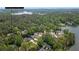 Breathtaking aerial view showcases waterfront homes and lush greenery along the serene lake at 5071 Woodmont Dr, Villa Rica, GA 30180