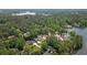 Picturesque aerial view featuring waterfront homes nestled amidst lush greenery, offering serene lake views at 5071 Woodmont Dr, Villa Rica, GA 30180