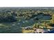 Expansive aerial view of the golf course surrounded by lush trees at 5071 Woodmont Dr, Villa Rica, GA 30180