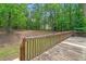 Wooden back deck overlooks a peaceful, wooded backyard at 5071 Woodmont Dr, Villa Rica, GA 30180