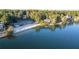 Scenic aerial view of the lake beach with white sand, showcasing the waterfront community and amenities at 5071 Woodmont Dr, Villa Rica, GA 30180