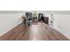 Bonus room with hardwood floors, a computer setup, desk, office chair, and stormtrooper at 5071 Woodmont Dr, Villa Rica, GA 30180