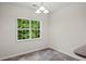 Cozy dining area offers a view of the backyard, complemented by a stylish light fixture at 5071 Woodmont Dr, Villa Rica, GA 30180