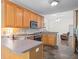 Open kitchen with stainless appliances, granite countertops and hardwood floors throughout at 5071 Woodmont Dr, Villa Rica, GA 30180