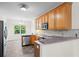 Bright kitchen features stainless appliances, wooden cabinets and a tiled backsplash at 5071 Woodmont Dr, Villa Rica, GA 30180