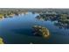 Picturesque aerial shot of a serene lake with lush islands, displaying the beauty of the surrounding landscape at 5071 Woodmont Dr, Villa Rica, GA 30180