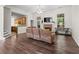 Spacious living room features a stone fireplace, hardwood floors and a ceiling fan at 5071 Woodmont Dr, Villa Rica, GA 30180