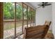Relaxing screened porch, perfect for enjoying the wooded view at 5071 Woodmont Dr, Villa Rica, GA 30180