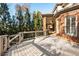 Large wooden back deck with covered patio in background at 13230 Addison Rd, Roswell, GA 30075