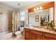 Bathroom with a vanity, granite countertop, and a shower/tub combination for a functional and stylish design at 13230 Addison Rd, Roswell, GA 30075
