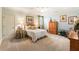 Bright bedroom featuring neutral decor, plush carpet, and decorative accents for a cozy and inviting atmosphere at 13230 Addison Rd, Roswell, GA 30075