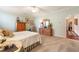 Neutral bedroom featuring carpet, a ceiling fan, and plenty of space for comfortable living and relaxation at 13230 Addison Rd, Roswell, GA 30075
