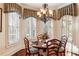 Charming breakfast nook with bay window and hardwood floors at 13230 Addison Rd, Roswell, GA 30075