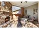 Outdoor seating area with stone fireplace at 13230 Addison Rd, Roswell, GA 30075