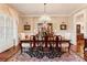 Elegant dining room features wainscoting, chandelier, and hardwood floors at 13230 Addison Rd, Roswell, GA 30075