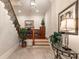 Inviting entryway with staircase, hardwood accents, built-in bookcase, and stylish decor at 13230 Addison Rd, Roswell, GA 30075