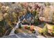 Charming brick home with a well-manicured lawn, long driveway, and beautiful landscaping at 13230 Addison Rd, Roswell, GA 30075