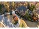 A sprawling house with meticulously landscaped gardens and verdant lawns and trees at 13230 Addison Rd, Roswell, GA 30075