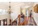 Grand foyer with hardwood floors and chandelier, creating a stunning entrance to the home at 13230 Addison Rd, Roswell, GA 30075