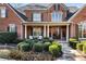 Stately brick home featuring a covered front porch with elegant columns at 13230 Addison Rd, Roswell, GA 30075