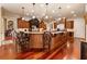 Spacious kitchen with dual islands, granite countertops, stainless steel appliances, and hardwood floors at 13230 Addison Rd, Roswell, GA 30075