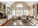 Cozy living room with fireplace and large windows at 13230 Addison Rd, Roswell, GA 30075