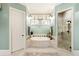 Relaxing main bathroom with tub, shower, and elegant fixtures, designed for comfort at 13230 Addison Rd, Roswell, GA 30075