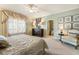 Bright and airy main bedroom featuring a luxurious bed, neutral tones, and a connected bathroom for added convenience at 13230 Addison Rd, Roswell, GA 30075