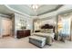 Beautiful main bedroom with a tray ceiling, plush carpets, and elegant decor at 13230 Addison Rd, Roswell, GA 30075
