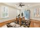 Bright office space with wood floors, shuttered windows, and a blue accent cabinet at 13230 Addison Rd, Roswell, GA 30075