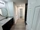 Bright bathroom with granite counters, dark wood cabinets, and sleek fixtures at 1341 E Atlanta E Rd, Stockbridge, GA 30281
