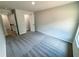 A bright bedroom featuring neutral walls, plush carpeting and an open closet at 1341 E Atlanta E Rd, Stockbridge, GA 30281