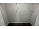 A view of an empty walk-in closet with shelving and neutral gray walls at 1341 E Atlanta E Rd, Stockbridge, GA 30281