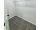 Walk-in closet with ample storage and neutral carpeting for organized living at 1341 E Atlanta E Rd, Stockbridge, GA 30281