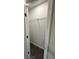 A view of an empty walk-in closet with shelving and neutral gray walls at 1341 E Atlanta E Rd, Stockbridge, GA 30281