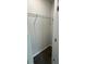 A view of an empty walk-in closet with shelving and neutral gray walls at 1341 E Atlanta E Rd, Stockbridge, GA 30281