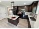 Modern kitchen with dark cabinets, granite countertops, stainless steel appliances, and a center island at 1341 E Atlanta E Rd, Stockbridge, GA 30281