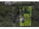 An aerial view showing a property surrounded by lush, mature trees and an estimated lot line at 1346 Wichita Sw Dr, Atlanta, GA 30311