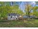 Wide backyard with wooden fence and small deck at 1346 Wichita Sw Dr, Atlanta, GA 30311