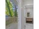 Balcony view leading to a bathroom with modern vanity and mirror at 1346 Wichita Sw Dr, Atlanta, GA 30311