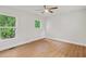 Well-lit bedroom with hardwood floors, two windows, and neutral paint at 1346 Wichita Sw Dr, Atlanta, GA 30311