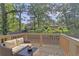 Outdoor deck with cozy wicker sofa overlooking yard at 1346 Wichita Sw Dr, Atlanta, GA 30311