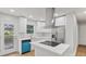 Modern kitchen featuring stainless steel appliances, white cabinets, and an island at 1346 Wichita Sw Dr, Atlanta, GA 30311