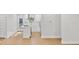 Open-concept kitchen with white cabinets, stainless steel appliances and island seating at 1346 Wichita Sw Dr, Atlanta, GA 30311