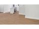 Spacious living room overlooking modern kitchen with light colored hardwood floors at 1346 Wichita Sw Dr, Atlanta, GA 30311